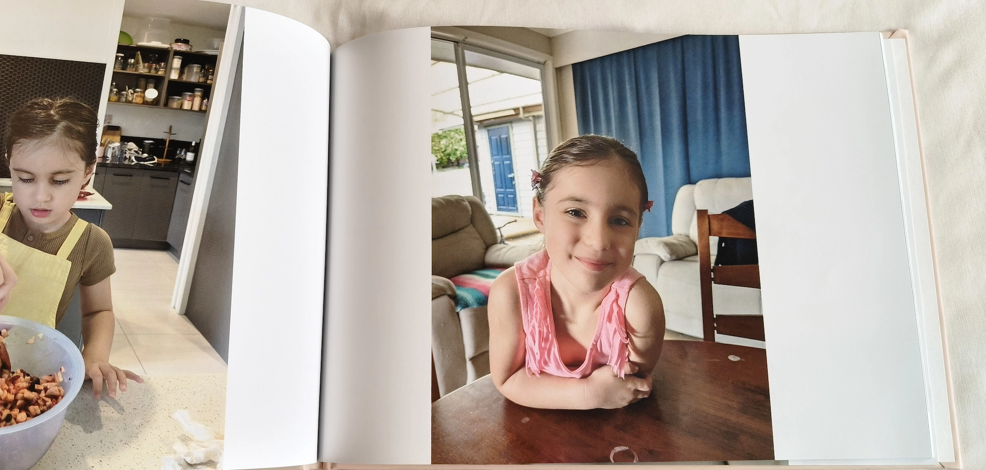 Open Evergreen Album showing printed family photos
